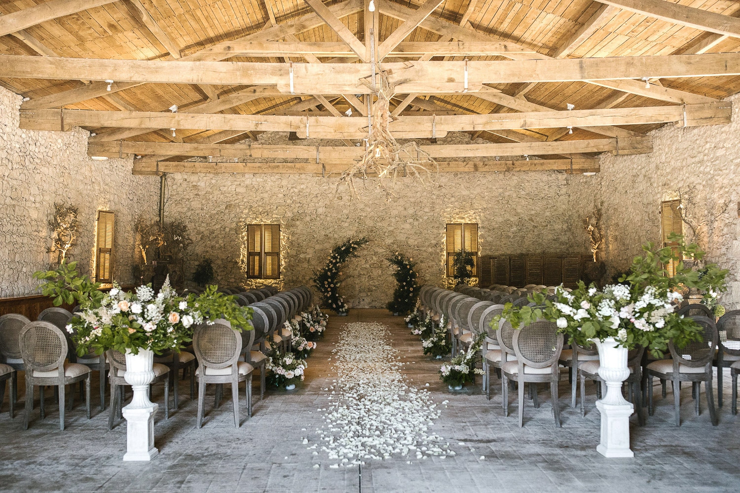 beautiful aisle ceremony with medicis altars and circle bakdrop
